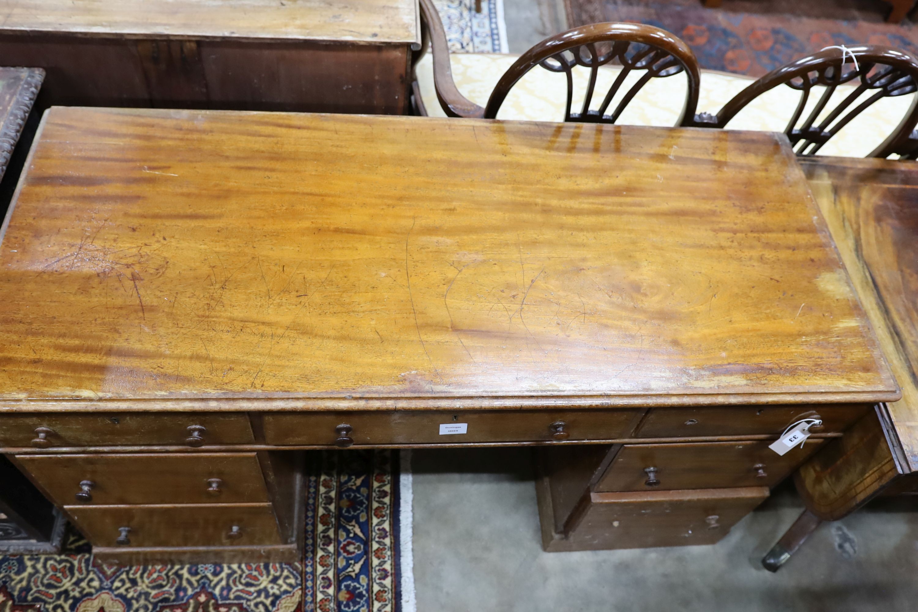 A Victorian mahogany pedestal desk, length 136cm, depth 58cm, height 76cm